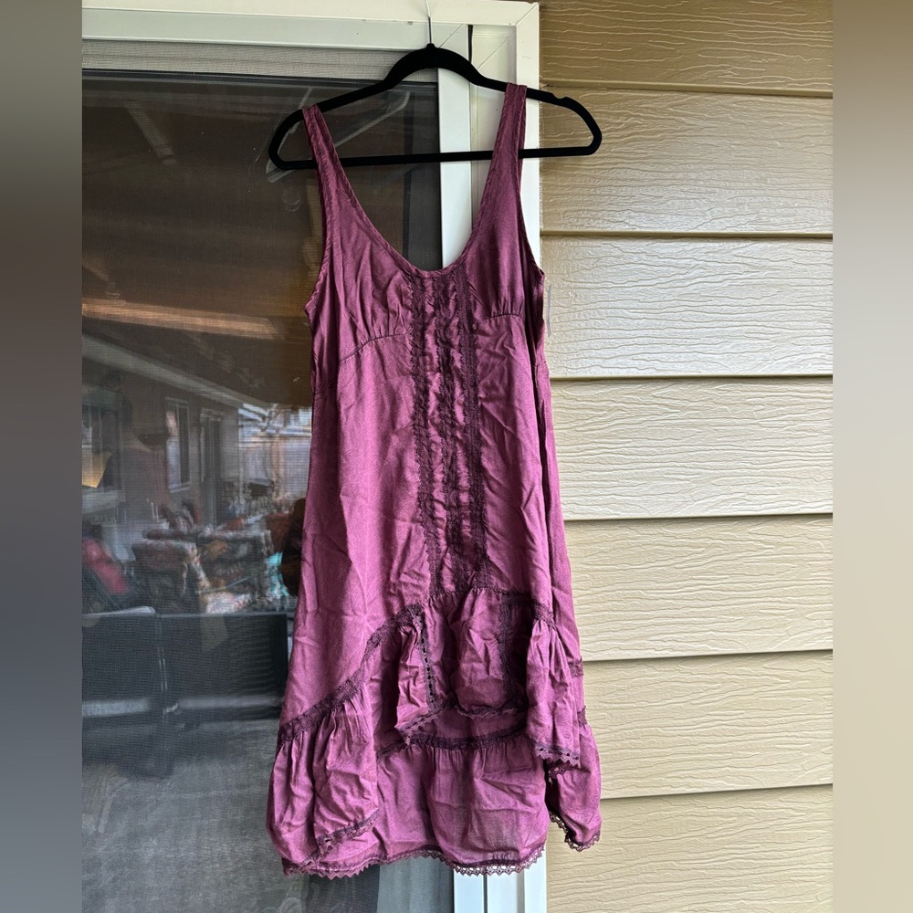 This is a Free People shirt dress, purple color, size XS